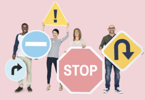 happy diverse people holding road signs happy diverse people holding road signs