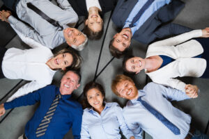 smiling business team lying floor circle smiling business team lying floor circle