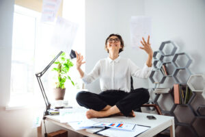 young beautiful businesswoman glasses smiling throwing up papers sitting table workplace office young beautiful businesswoman glasses smiling throwing up papers sitting table workplace office