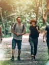 Group of Friends Walking Together into the Forest for Adventure