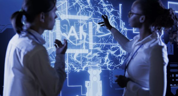 qualified technicians brainstorm ways use ai cognitive computing extract usable information from complex data team specialists implement artificial intelligence process massive datasets